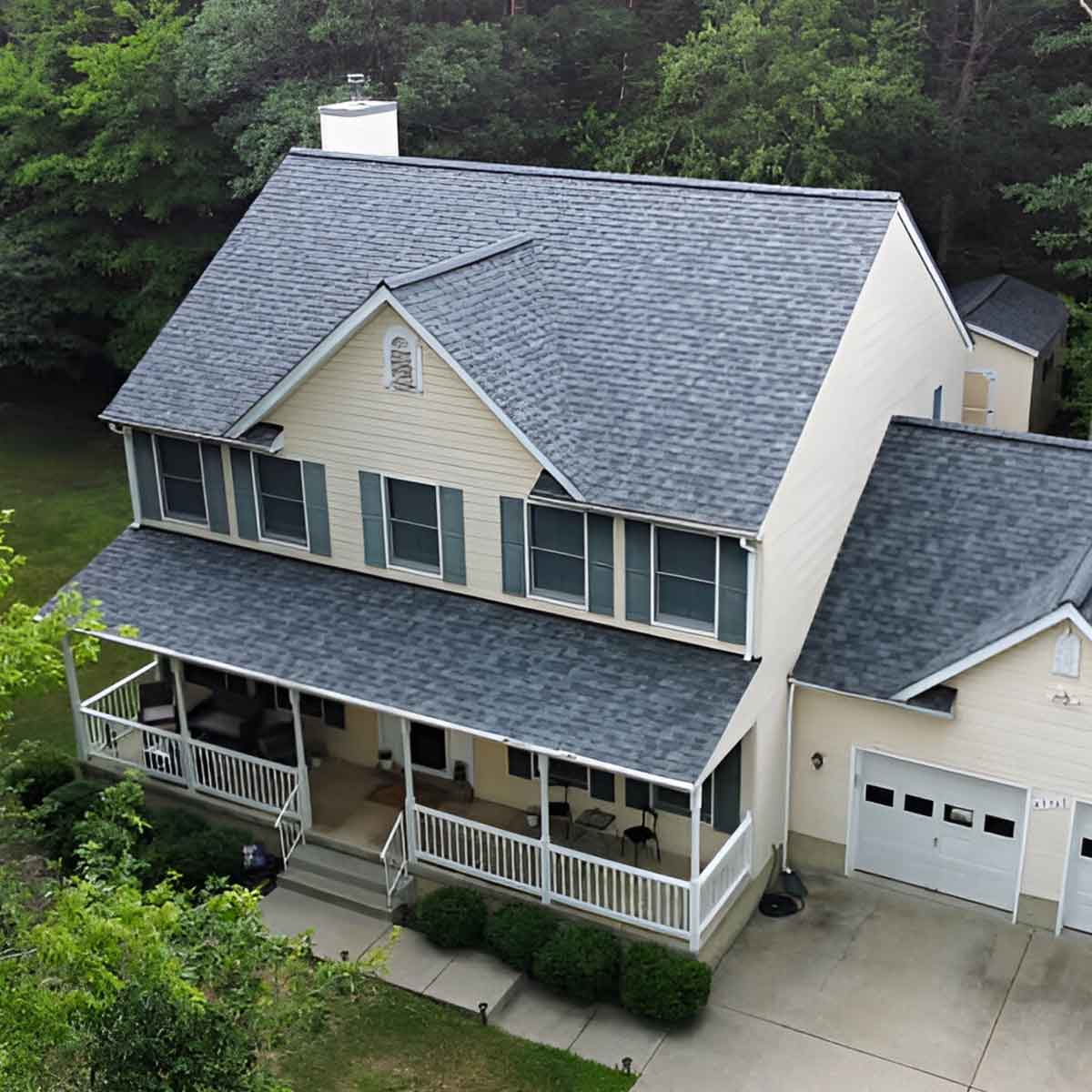 JDH Remodeling completed La Plata Maryland 2-story colonial home with new Owens Corning Duration Estate Gray asphalt shingle roof installed across the Heritage Green or Stonehaven subdivision housing pattern