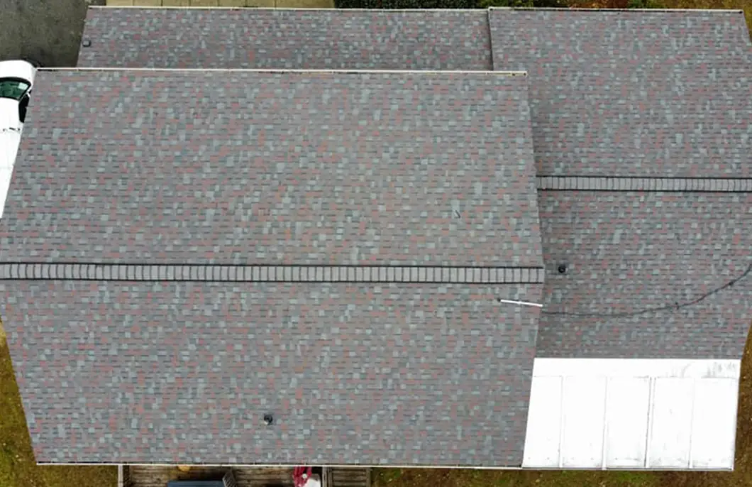 JDH Remodeling completed Owens Corning Duration Colonial Slate asphalt shingle roof on a Dunkirk Maryland home with white exterior and red shutters as a State Farm Insurance roof inspection install