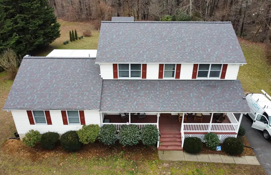 JDH Remodeling completed Owens Corning Duration Colonial Slate asphalt shingle roof on a Huntingtown Maryland home with white exterior and red shutters as a State Farm Insurance roof inspection install