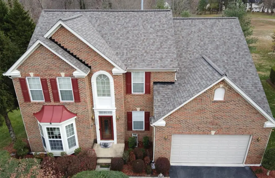 JDH Remodeling Owens Corning Duration Driftwood asphalt shingle replacement on a two-story brick colonial Hughesville Maryland home documented as a HAAG insurance roof inspection before-state