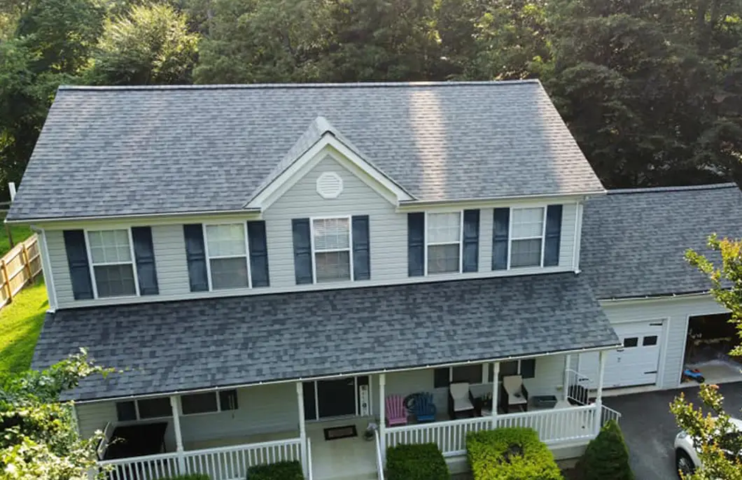 JDH Remodeling completed Owens Corning Duration Colonial Slate asphalt shingle roof on a Port Republic Maryland home with white exterior and red shutters as a State Farm Insurance roof inspection install