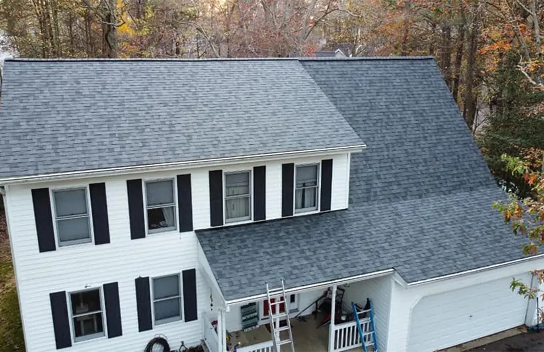 JDH Remodeling completed Owens Corning Duration Slatestone Gray asphalt shingle roof on a two-story Twin Beaches area Maryland home with black shutters as a USAA Insurance roof inspection install