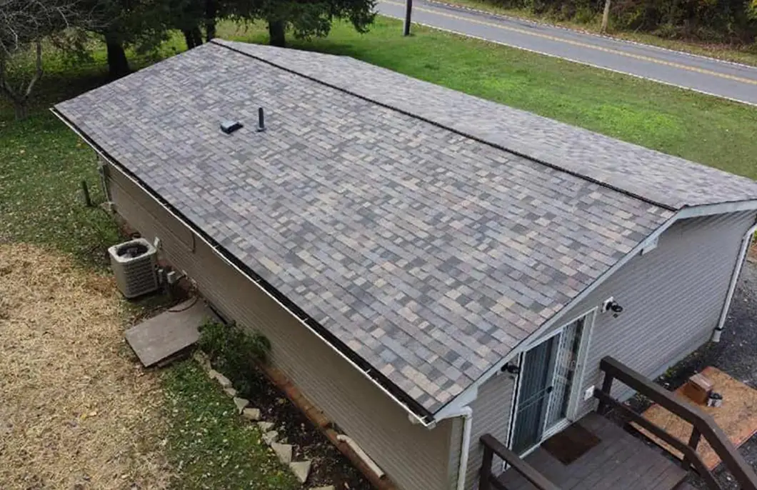 Aerial view of completed Owens Corning Duration Summer Harvest asphalt shingle roof installation on a Lusby Maryland Chesapeake Ranch Estates home documented as a USAA insurance claim by JDH Remodeling