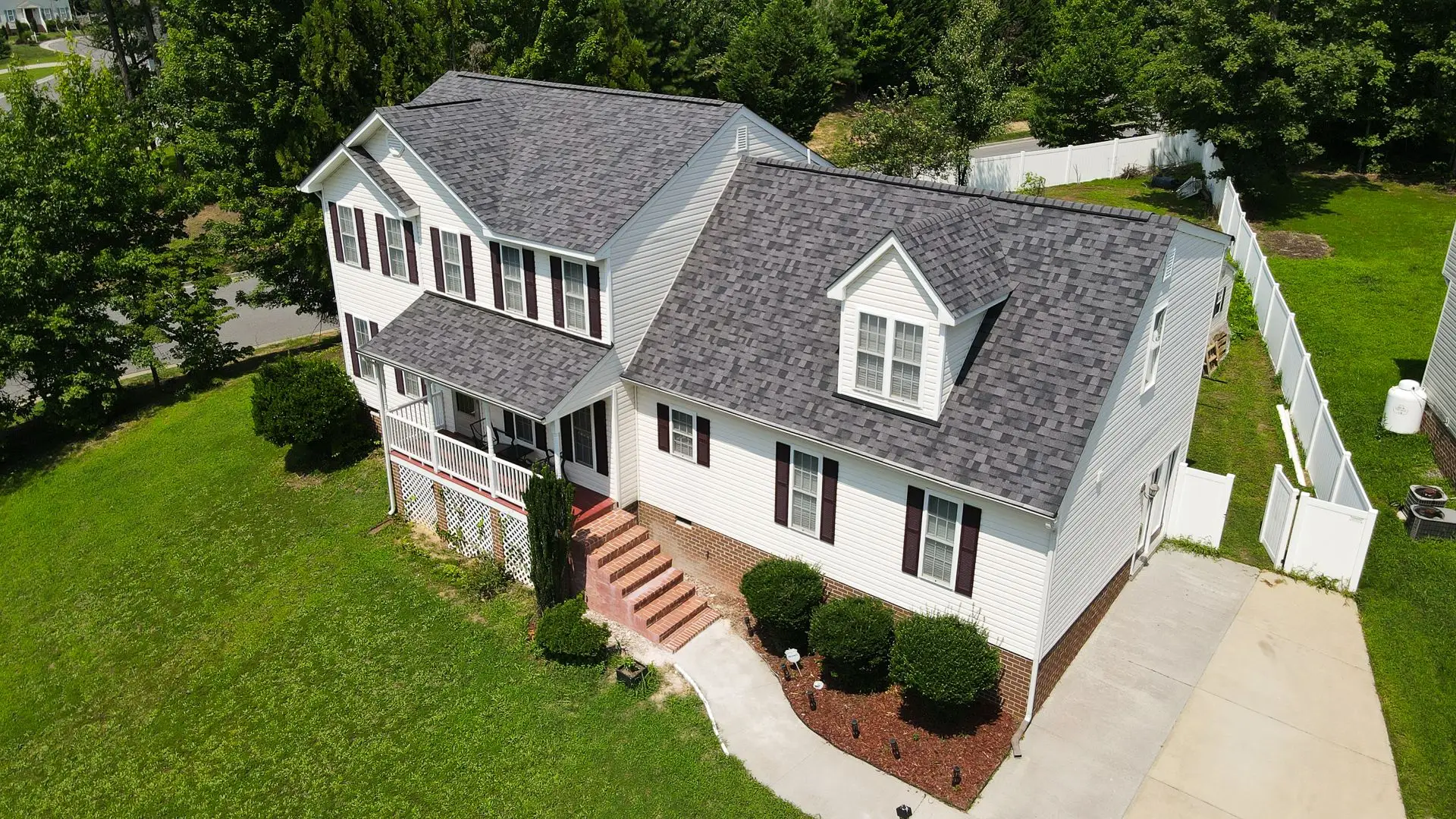 JDH Remodeling completed La Plata Maryland 2-story colonial roof replacement in Owens Corning Duration Midnight Plum showing premium asphalt shingle installation across the Charles County seat 20646 footprint