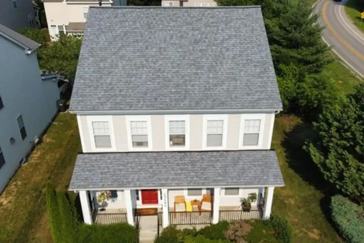 Aerial view of a completed Wildewood California Maryland farmhouse roof with white trim served by JDH Remodeling