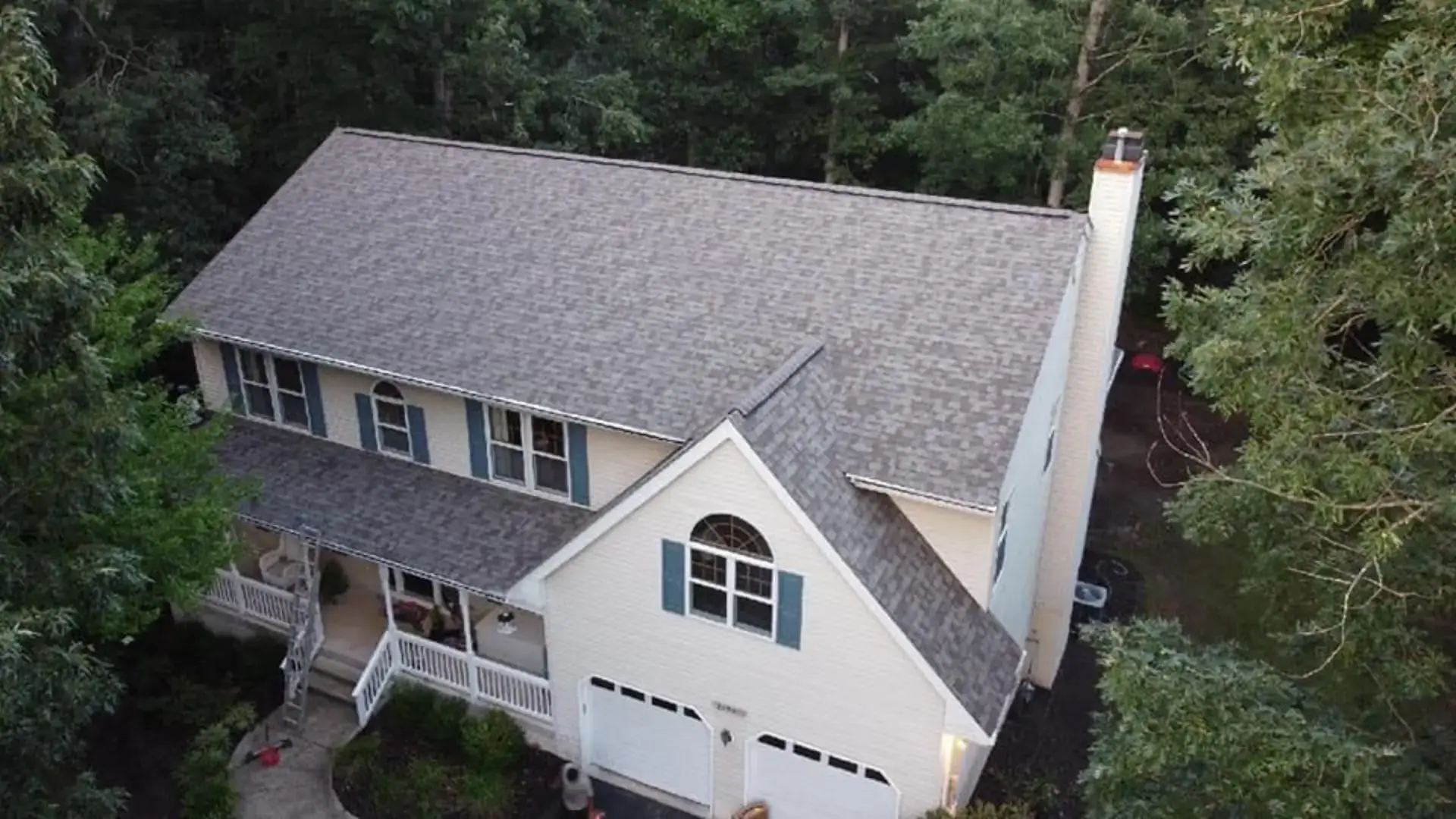 Emergency tarp installation to stop active roof leak on a Maryland home