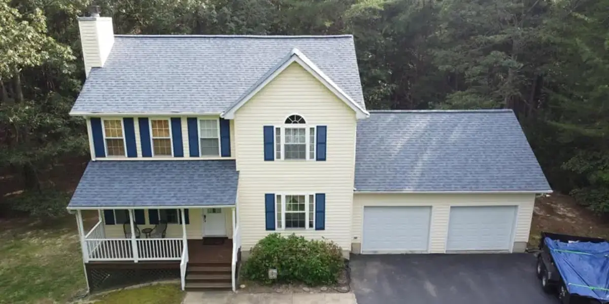 JDH Remodeling completed storm-damage roof repair on a two-story Loveville Maryland colonial with new roof and blue shutters adjacent to Mechanicsville in the 20656 USPS-shared corridor