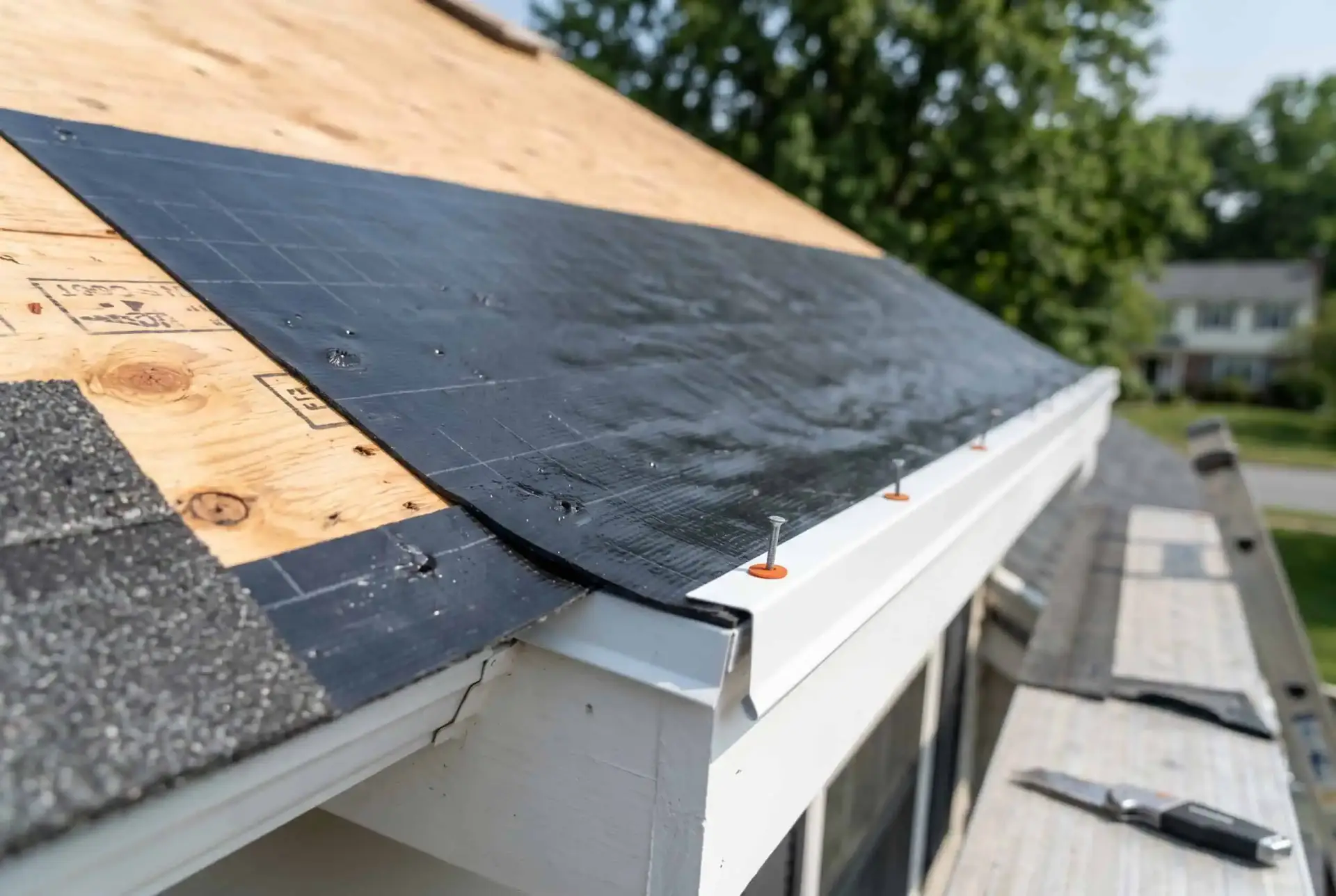 Black rubberized ice-and-water-shield membrane installed on roof decking to prevent ice dams