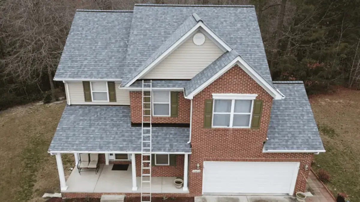 JDH Remodeling aerial overhead of two Dunkirk Maryland homes with dark asphalt shingle roofs and manicured landscaping