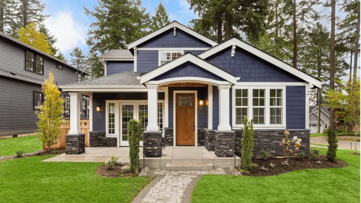Modern home in Deale, Maryland with new entry door, siding, windows, and stone-accented covered porch