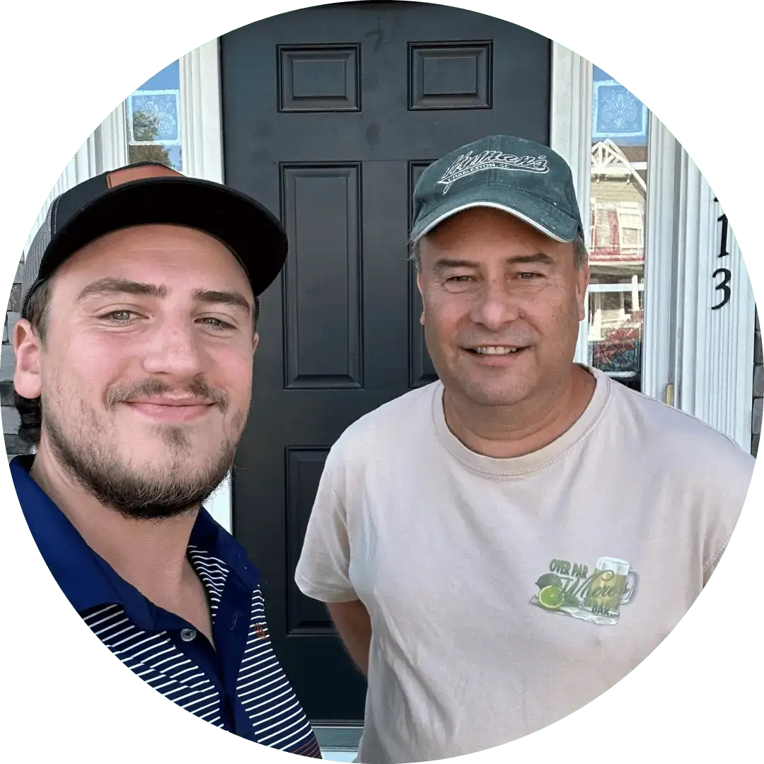 Satisfied JDH Remodeling customer in Wildewood California Maryland shaking hands with a JDH HAAG inspector after a completed roof replacement