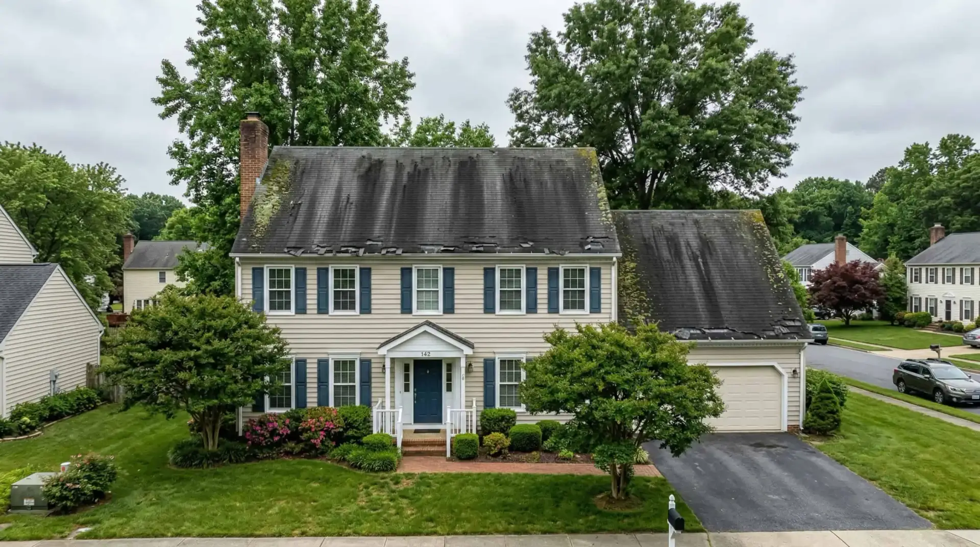 Heavy Gloeocapsa algae streaking on an aging shingle roof in Prince Frederick, MD