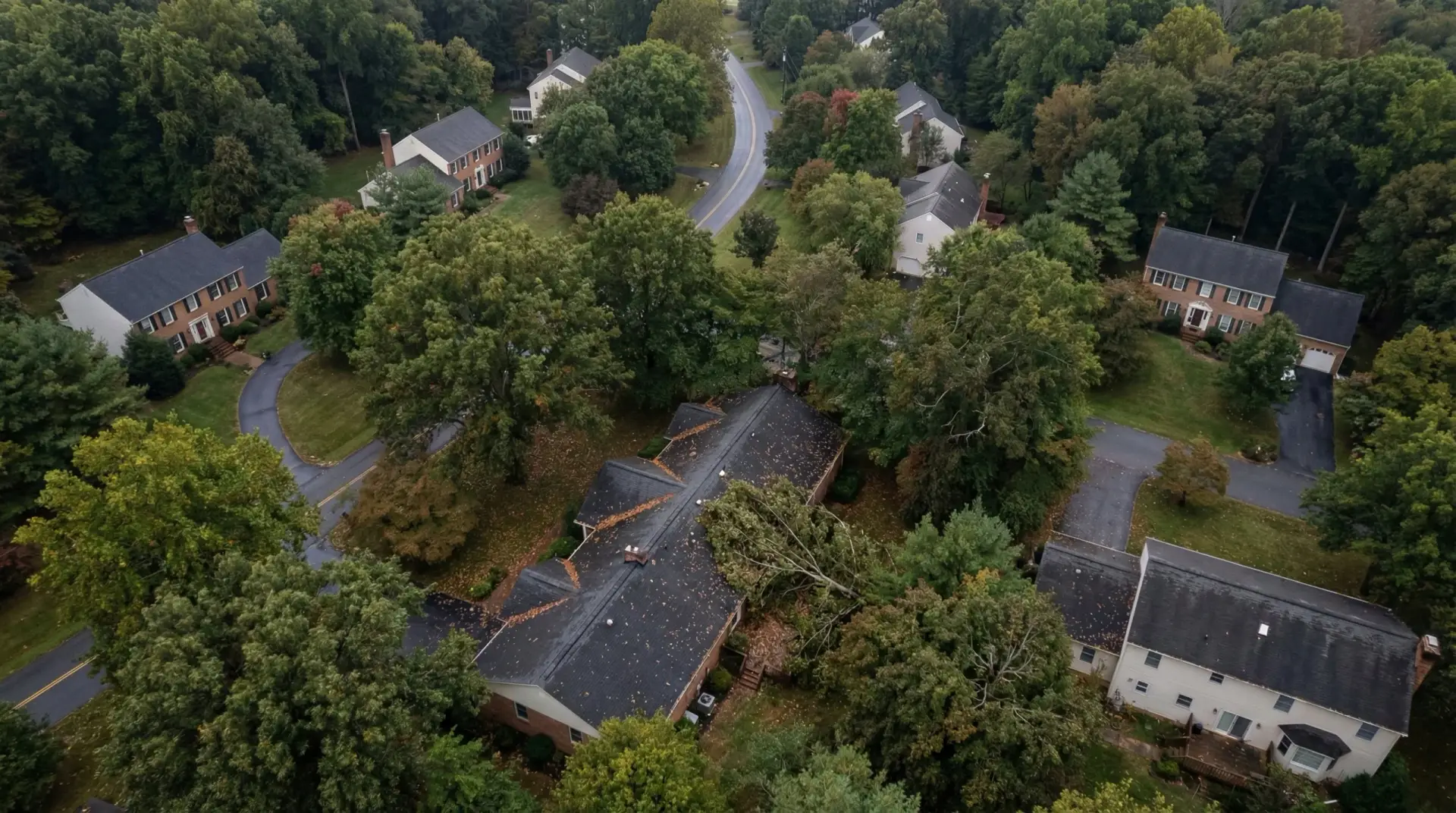 Aerial view of a Huntingtown Maryland residential home during active roof replacement with tear-off and new shingles in progress documented by JDH Remodeling