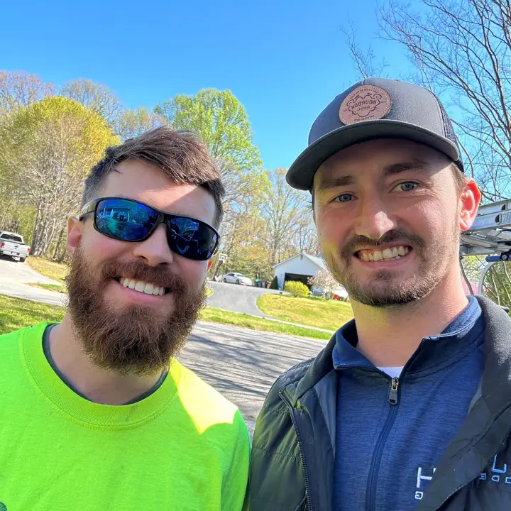 JDH Remodeling contractor shaking hands with satisfied homeowner after completing a roof repair in Chesapeake Beach Maryland