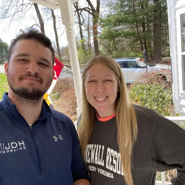 JDH Remodeling roof repair customer handshake in Huntingtown, Maryland