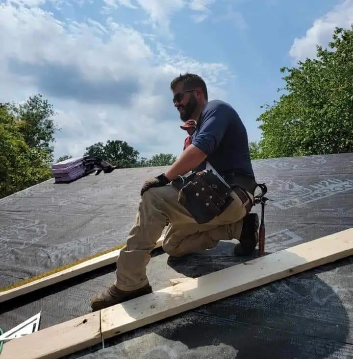 Jim Dodson, third-generation JDH Remodeling owner, installing shingles with his crew in Maryland