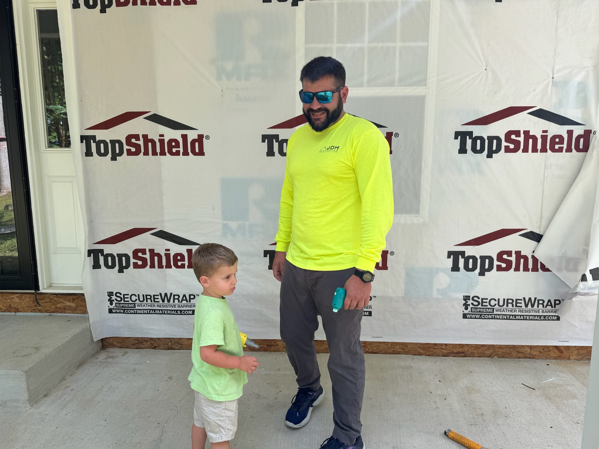 Jim Dodson with his son J.J. on a JDH Remodeling jobsite, three generations of Dodsons in the trades