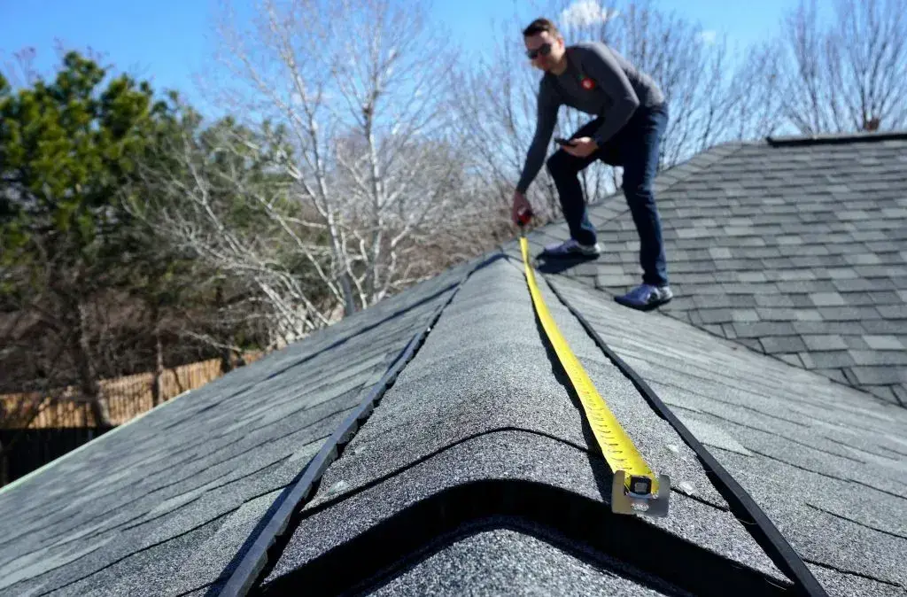 JDH Remodeling inspecting a roof in Wildewood, MD