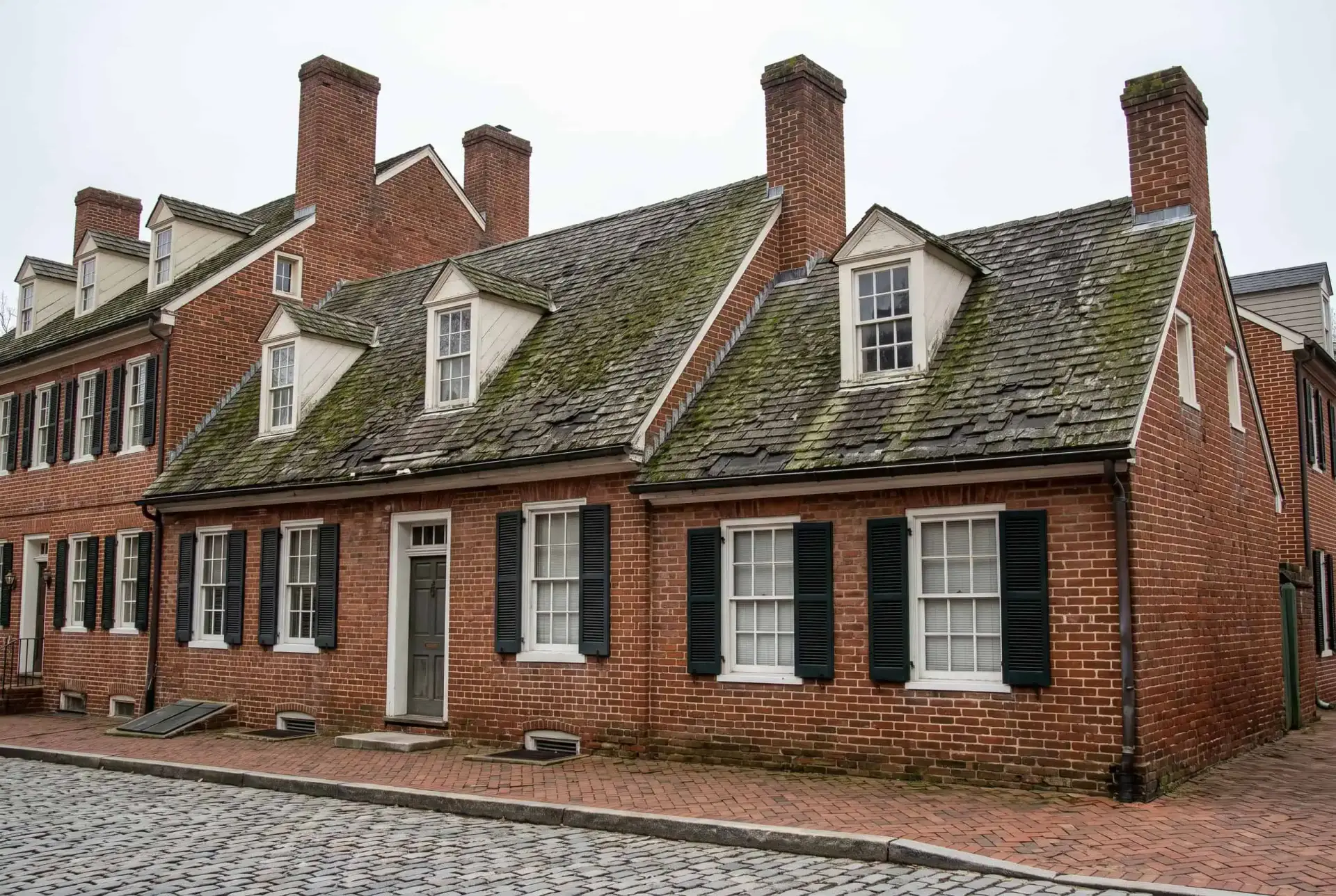 Storm-damaged historic home in Annapolis, MD before roof restoration